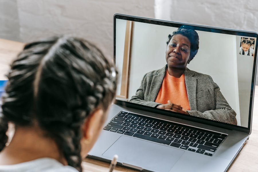 Kenyan student learning online with a tutor via video call